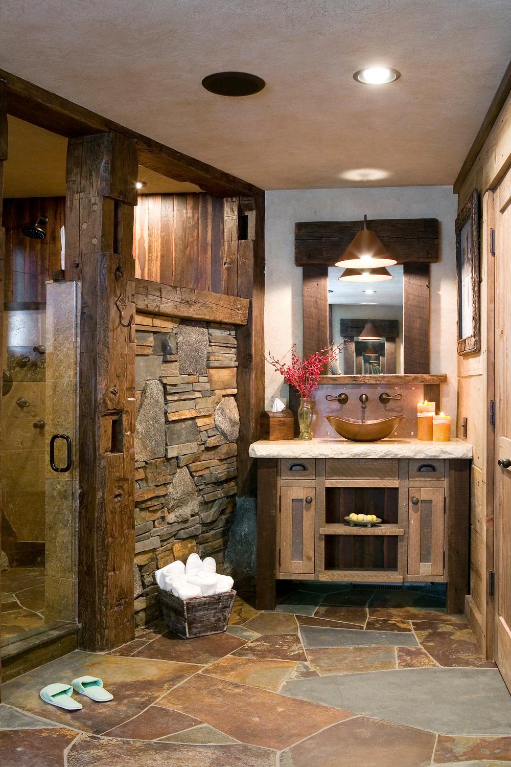 Rustic bathroom with slate tile flooring and wooden accents