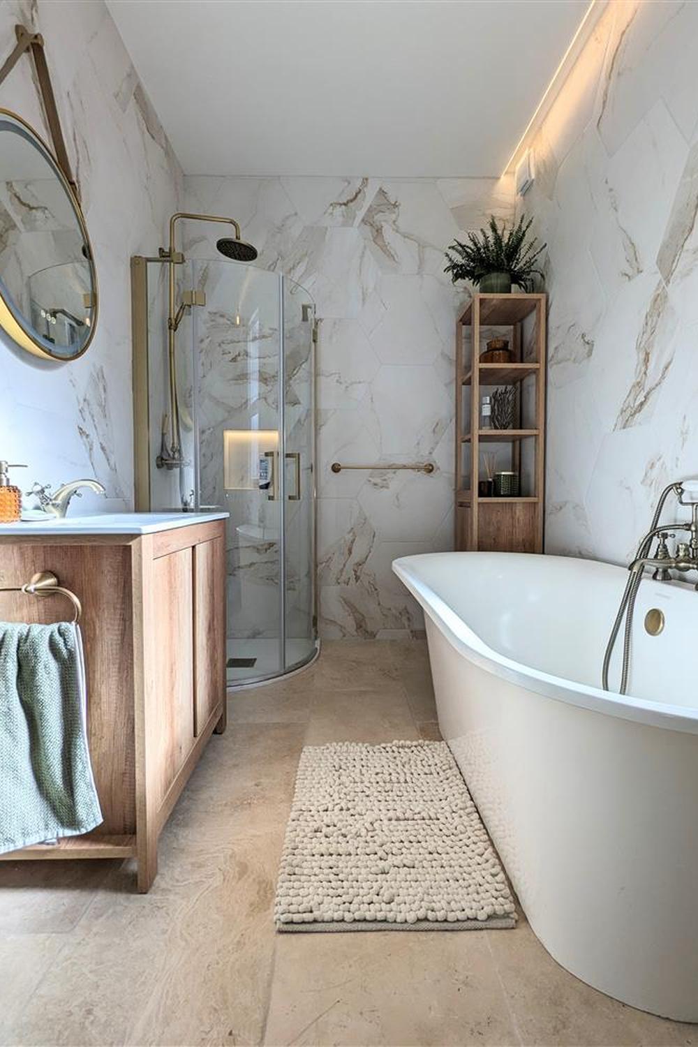 Inviting small bathroom with soft marble tiles and a freestanding bathtub