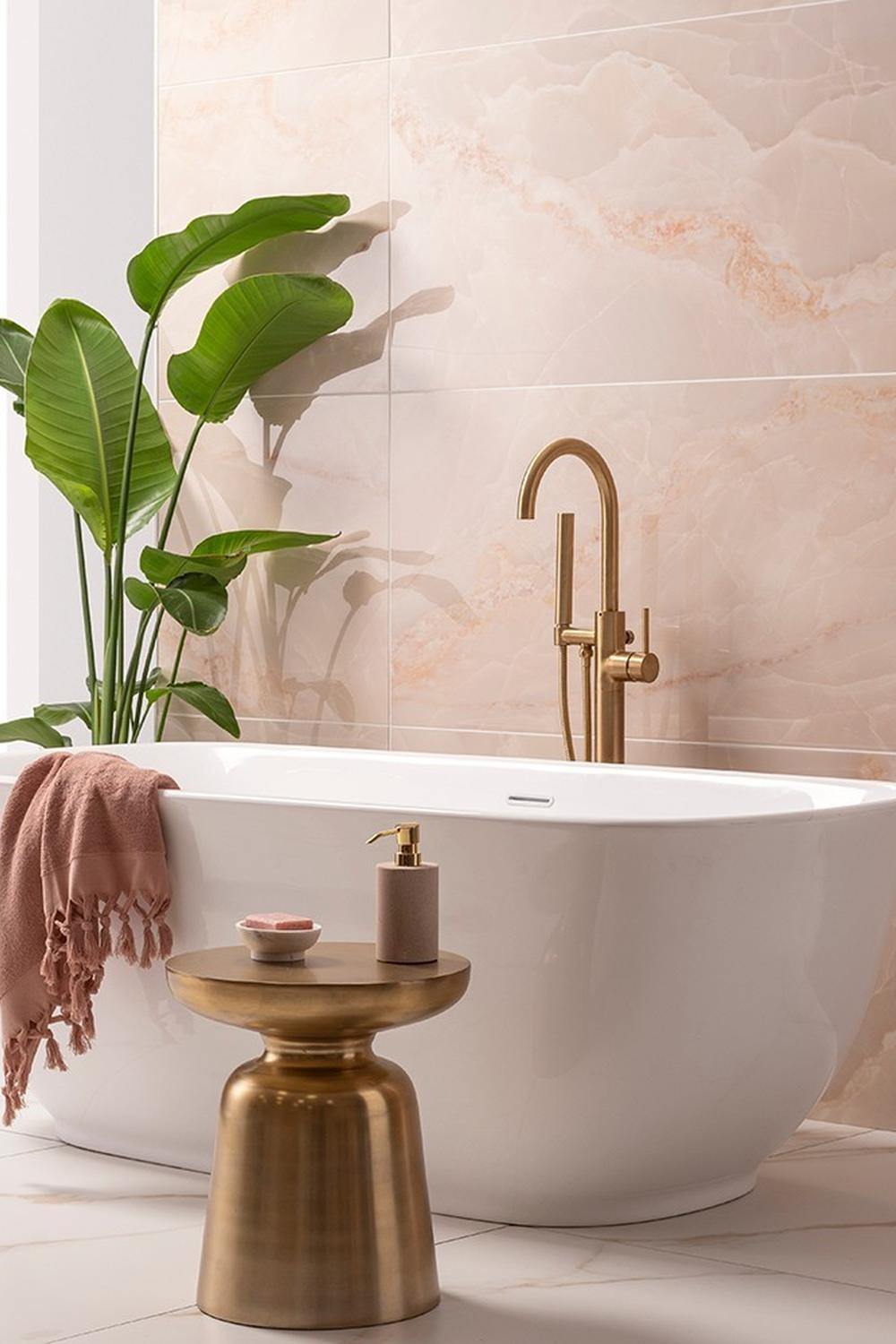 A charming bathroom featuring soft pastel tiles and beautiful decorative elements creating a soothing oasis.