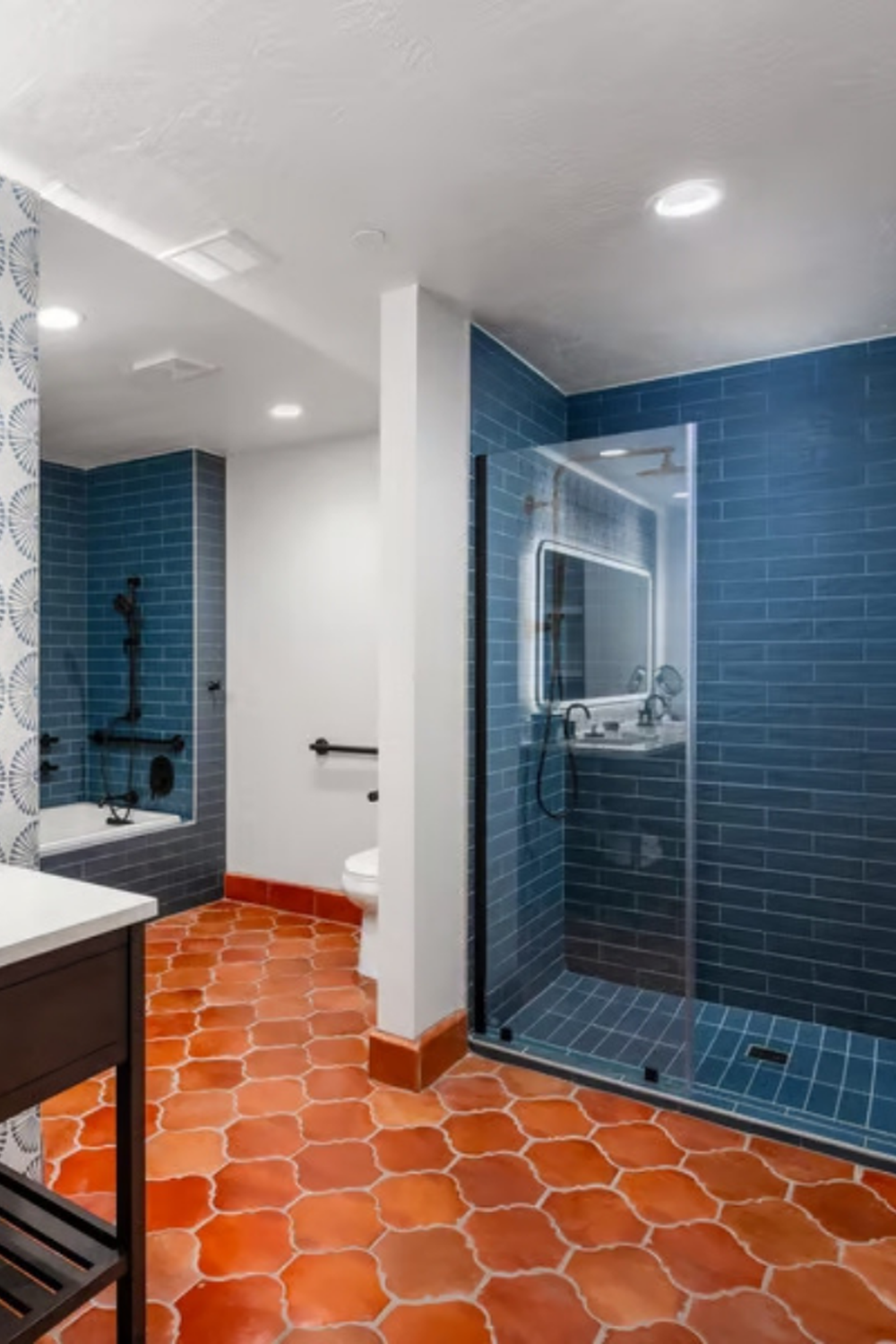 Modern bathroom featuring terracotta Spanish tiles and contemporary finishes