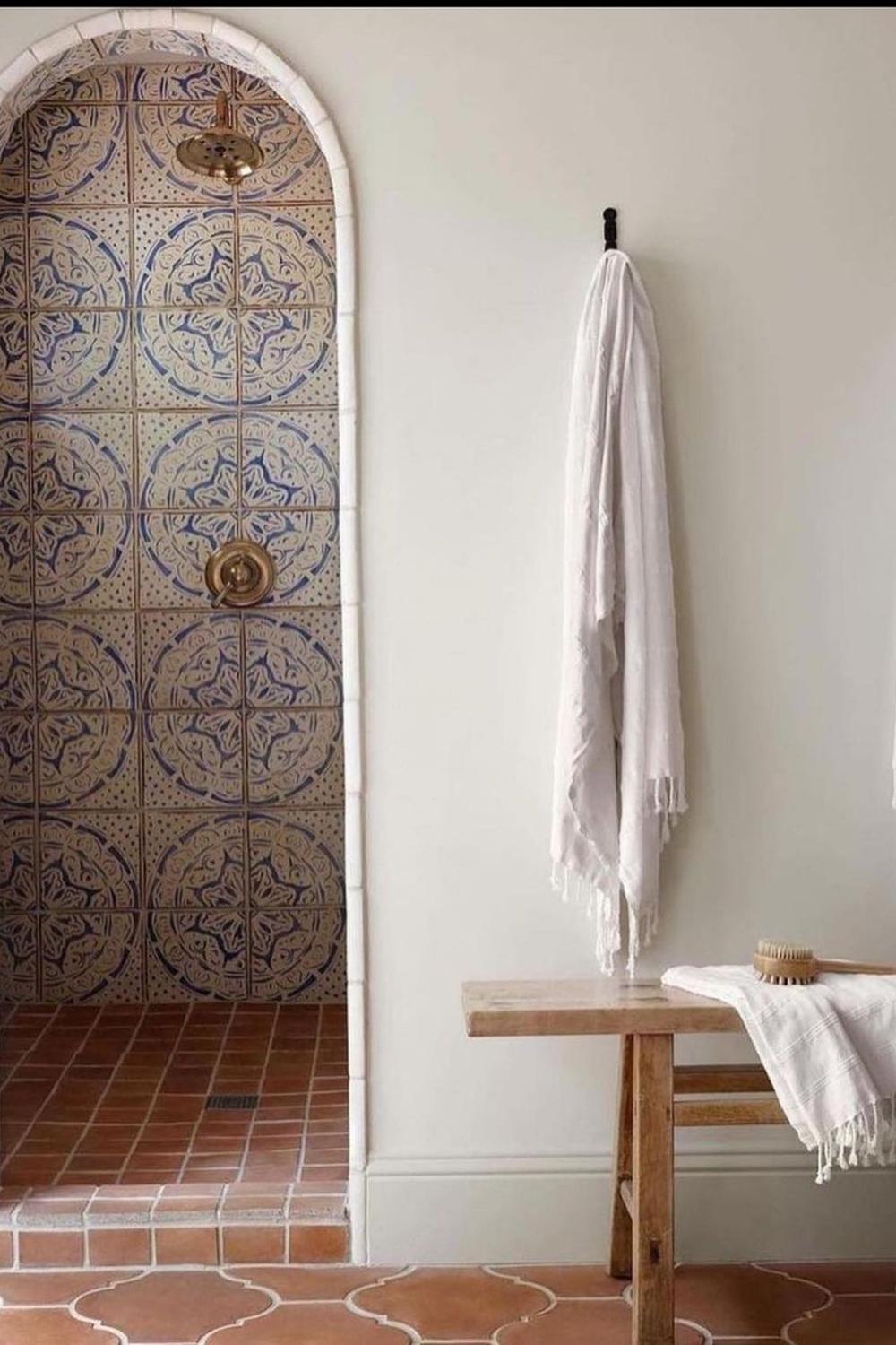Spa-like bathroom design with earthy tones and tiled accents