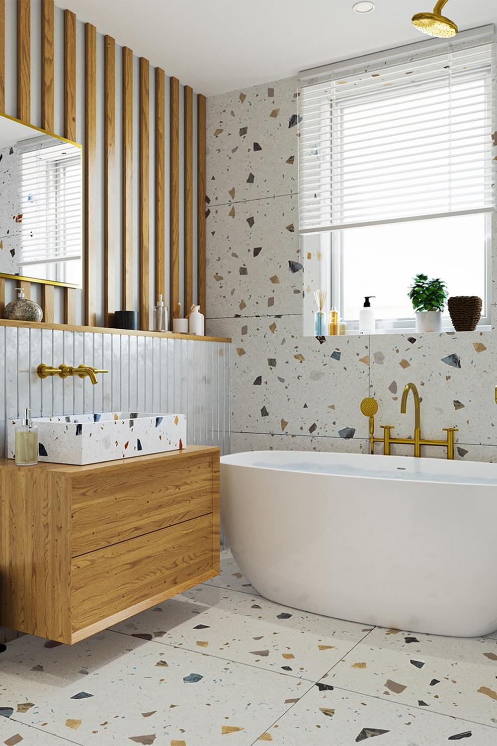 Baño moderno con bañera independiente y azulejos de terrazo