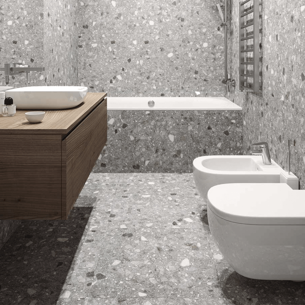 Baño moderno con azulejos y suelo de terrazo gris