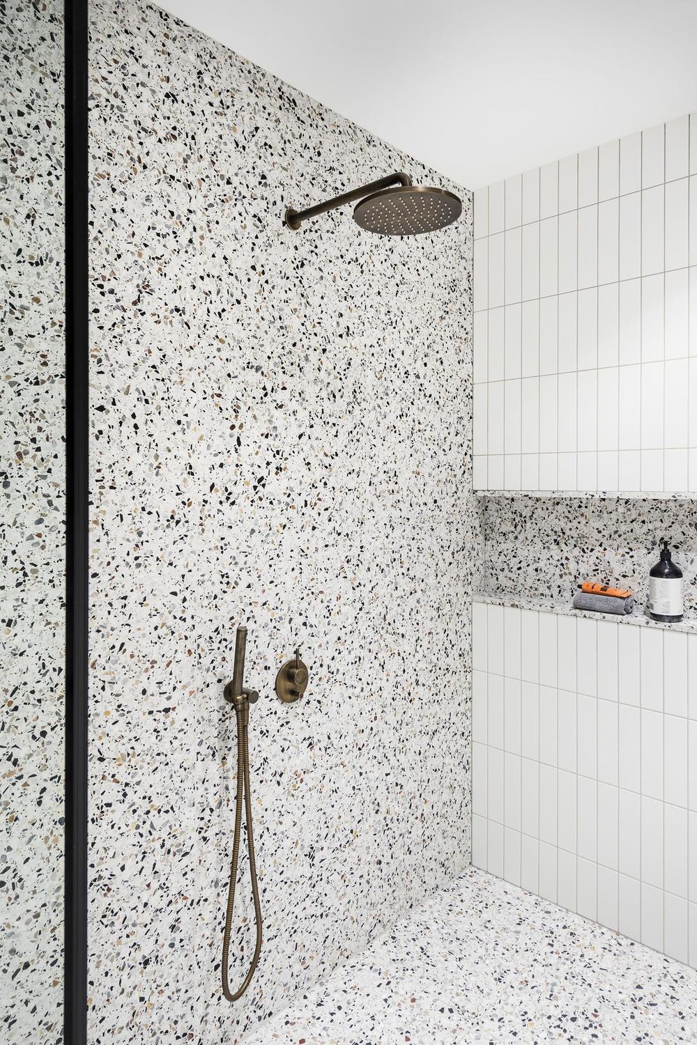 Cozy bathroom with chic modern design and terrazzo details.