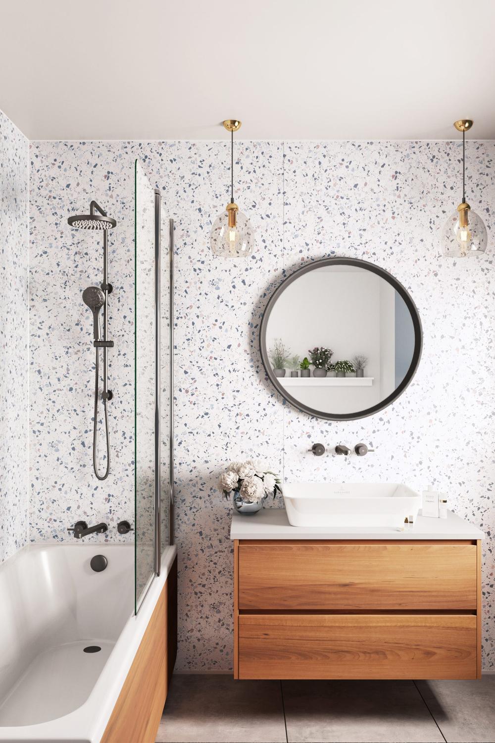 Modern bathroom utilizing terrazzo design features as a focal backdrop.