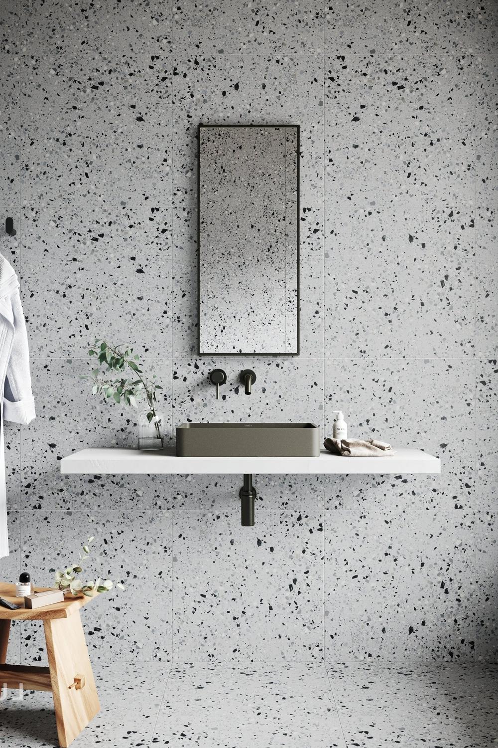 Modern bathroom with clean design featuring terrazzo surfaces and stylish decor.