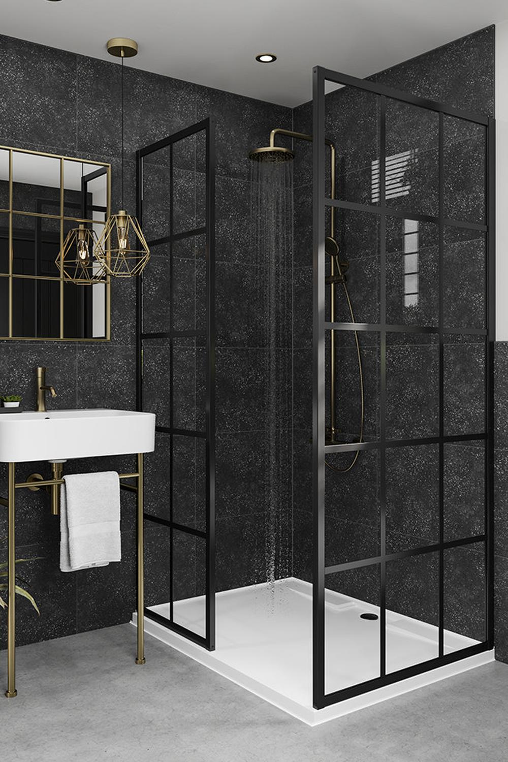 Baño moderno con azulejos negros y luz natural