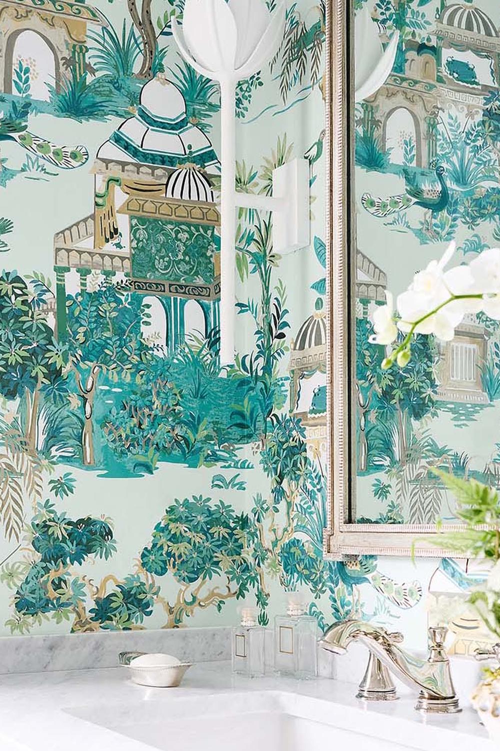 Beautifully designed bathroom with Thibaut wallpaper featuring lush botanical scenery