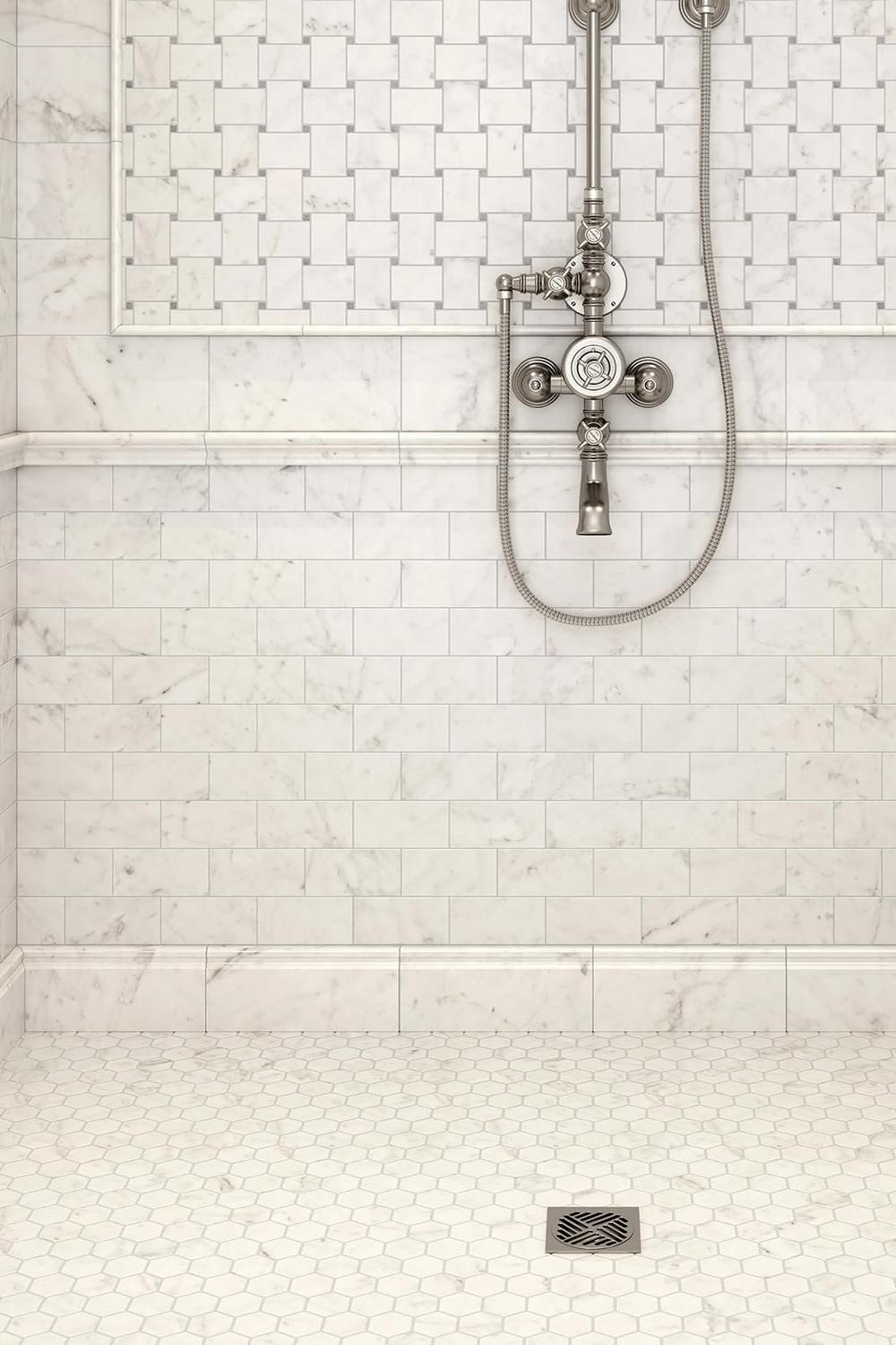 Elegant bathroom shower with white marble tiles and stylish fixtures.