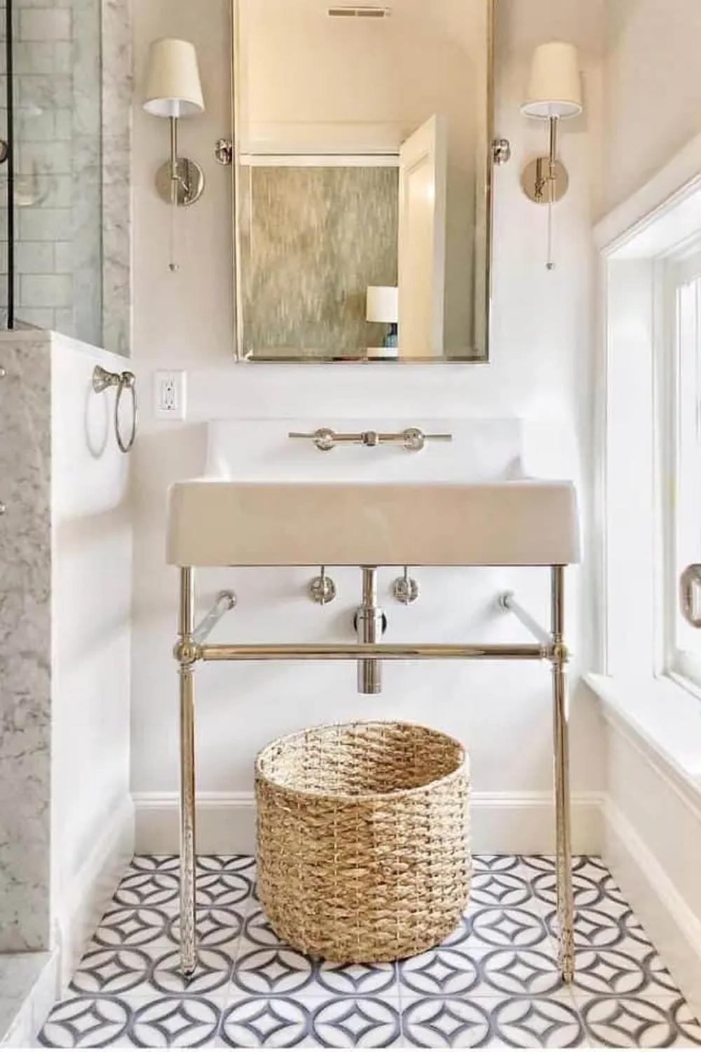 Stylish bathroom with a rectangular sink, chrome stand, and geometric floor design.