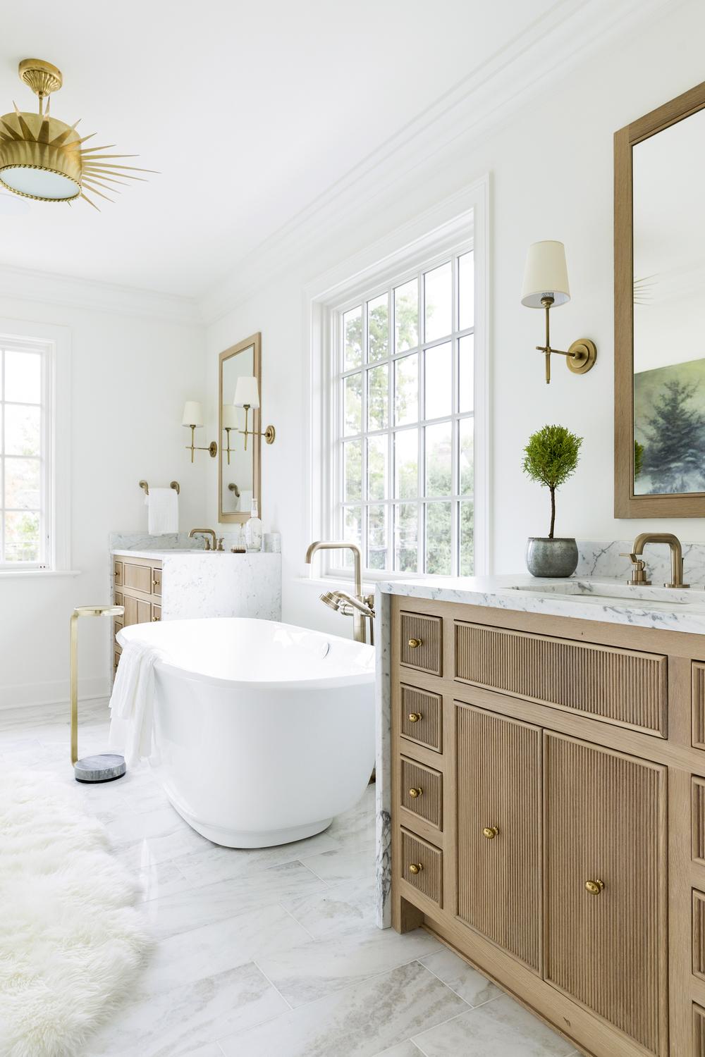 Bright bathroom inspired by nature featuring a freestanding tub and a color palette that encapsulates serenity.