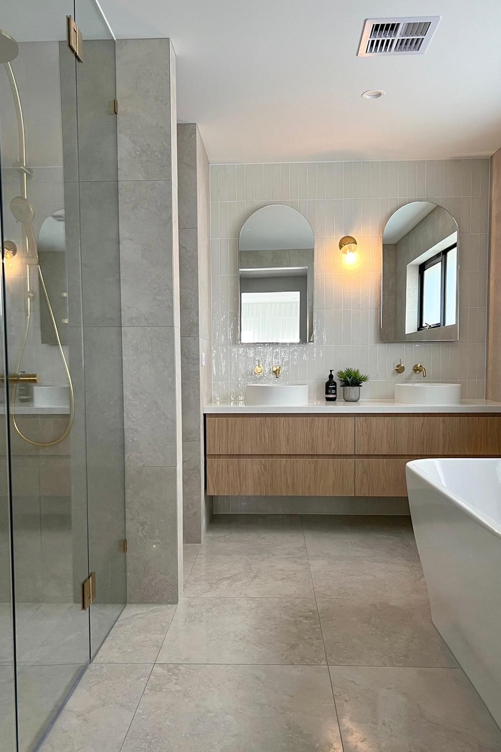 Modern bathroom with light-colored travertine tile flooring