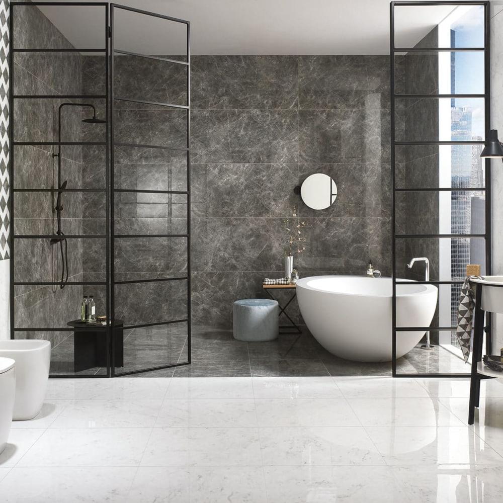 Modern monochrome bathroom featuring textured gray tiles and sleek fixtures.