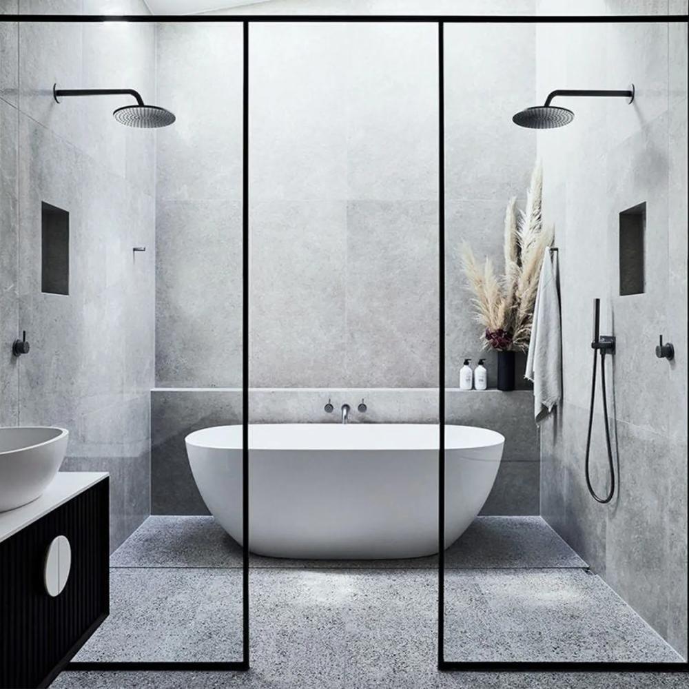 Minimalist bathroom featuring grey tones with a spacious modern feel.
