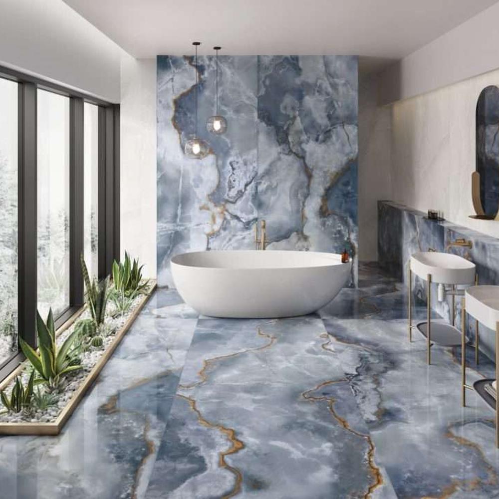 Bathroom featuring a chic blue and white tile scheme for a refreshing retreat.