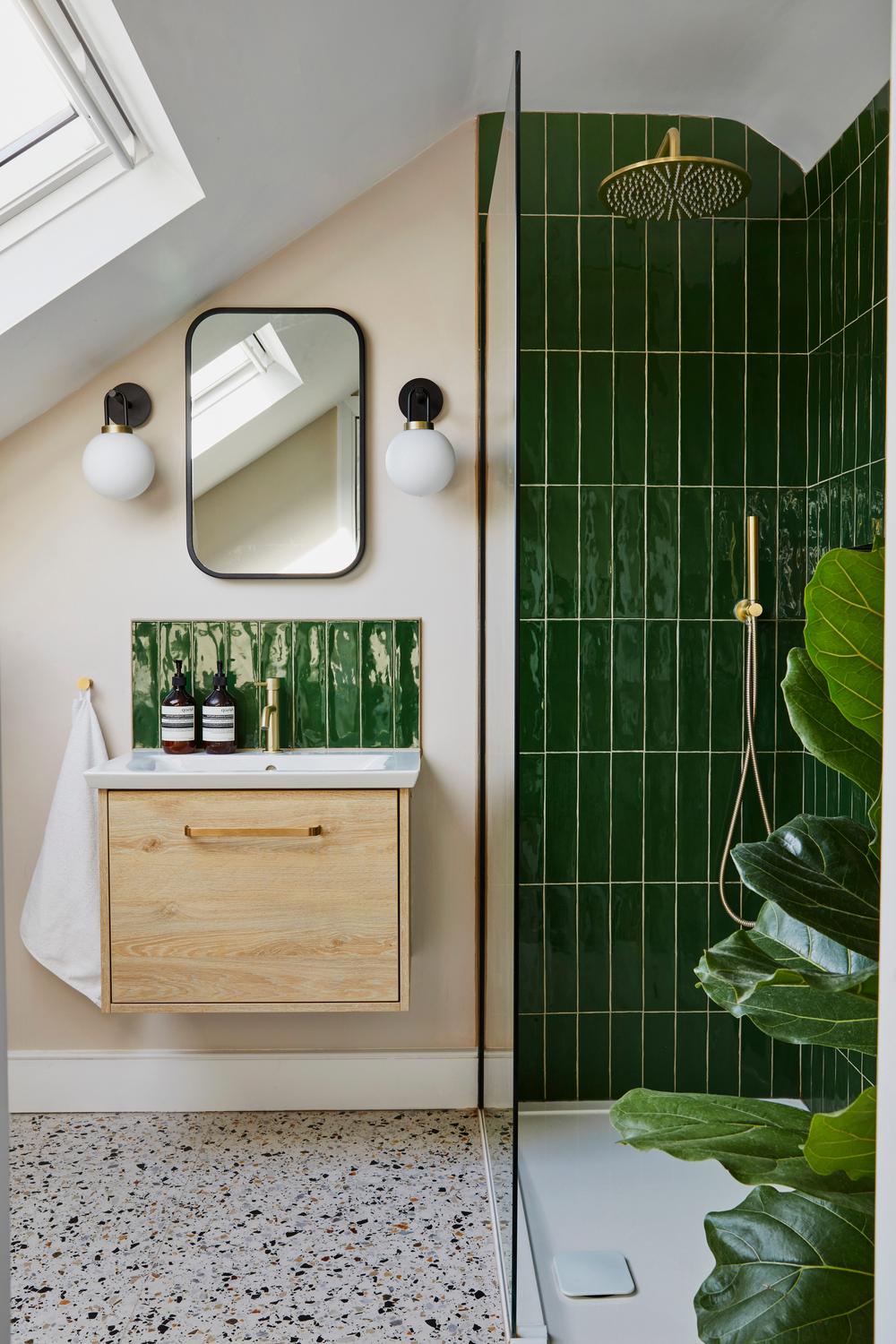 Bathroom featuring chic emerald green tiles for a luxurious touch.