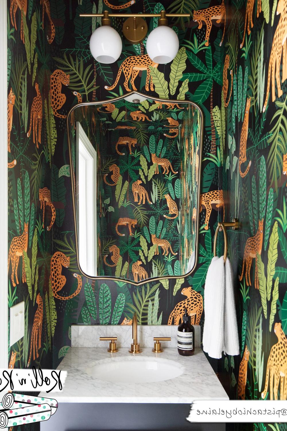 Striking tropical wallpaper with leopards, lush green foliage, and a stylish bathroom setup