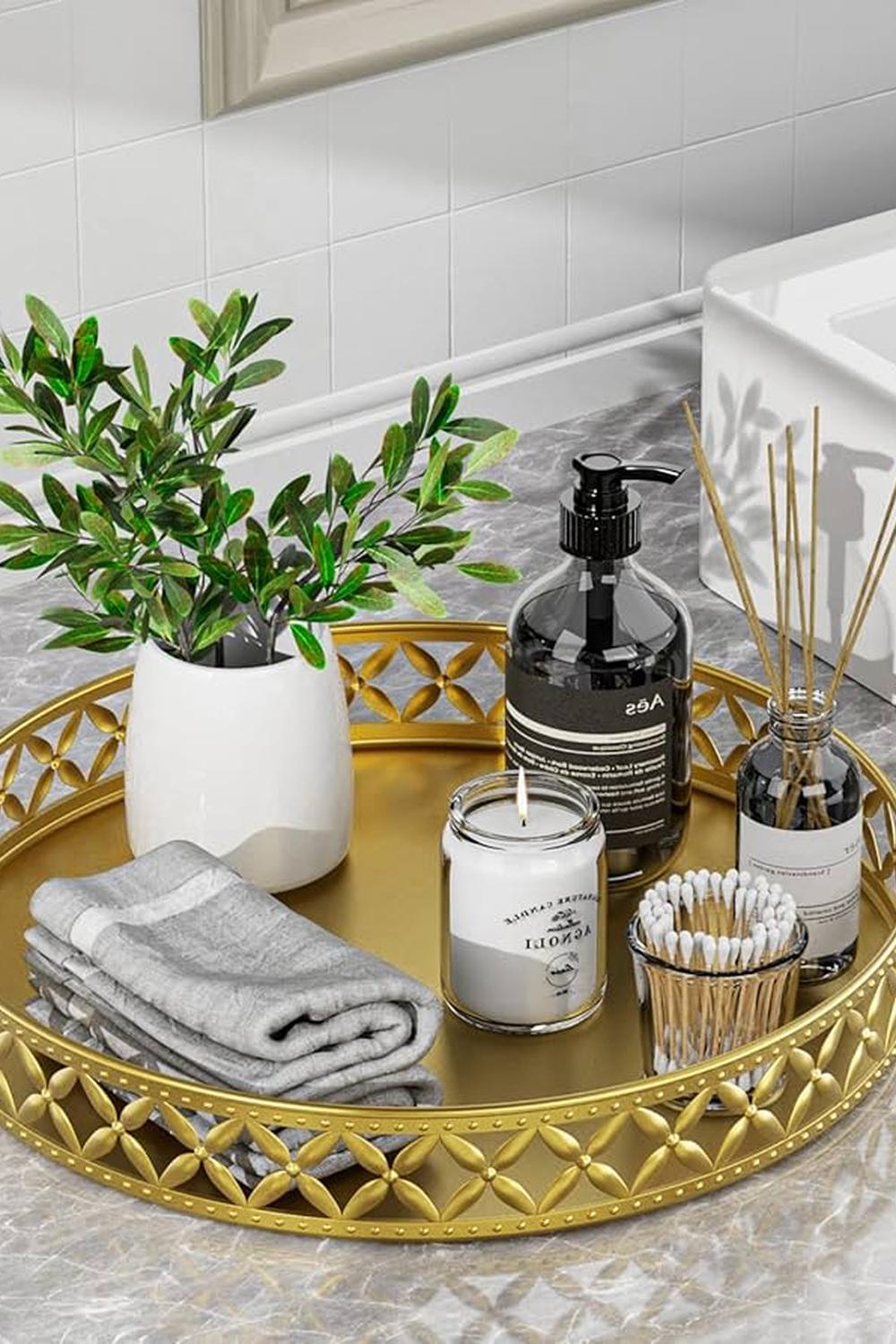 Modern grey vanity tray with stylish accessories and cozy elements.