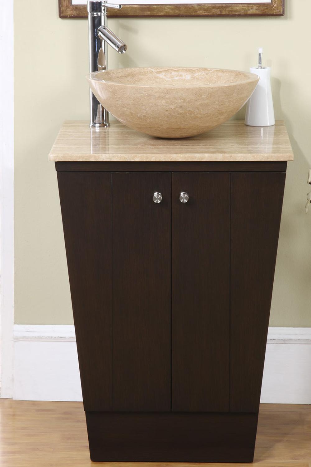 Warm brown oval vessel sink on dark wood vanity