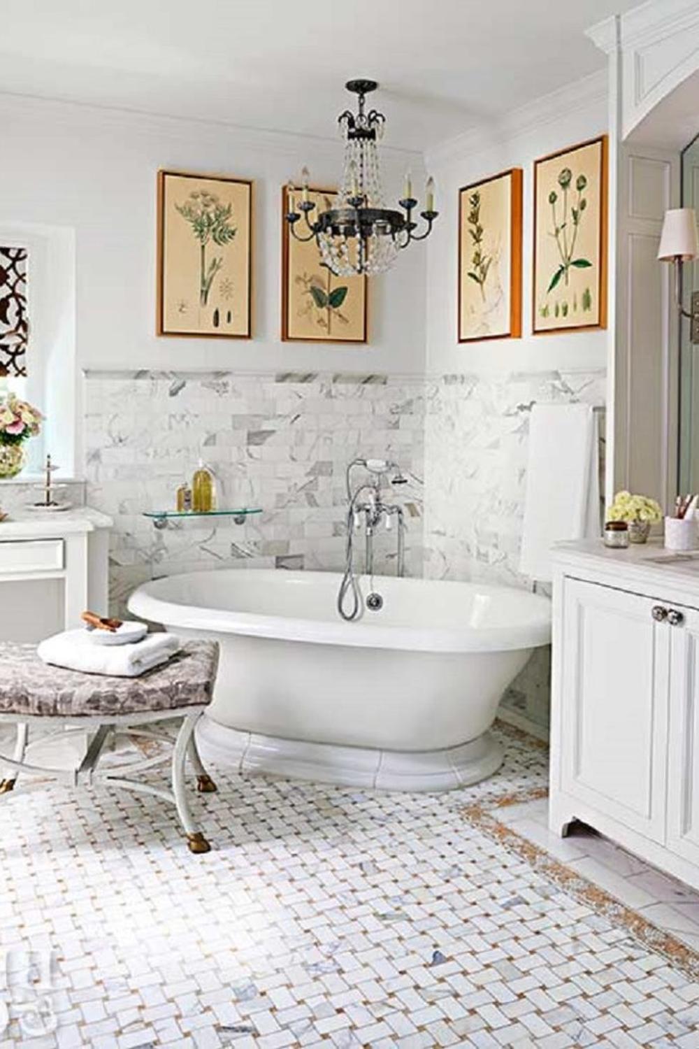 A beautifully designed Victorian bathroom featuring intricate botanical prints and an ornate chandelier.