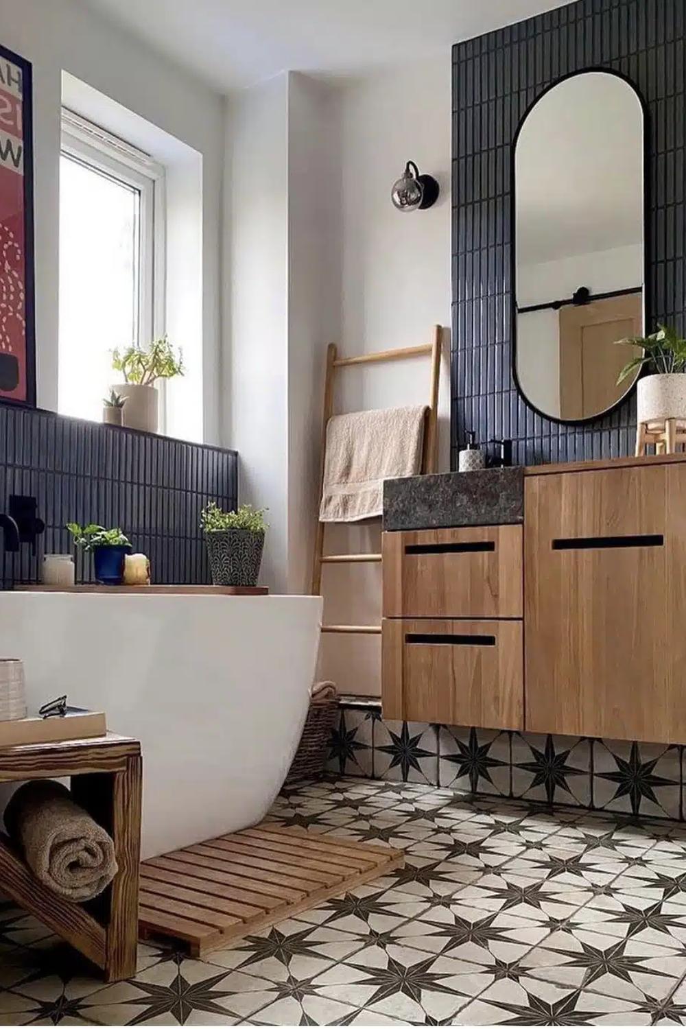 A stylish Victorian bathroom with patterned tiles and an oval-shaped bathtub.