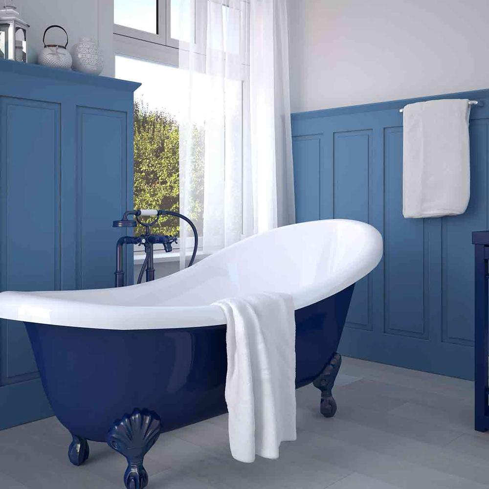 An elegant Victorian bathroom characterized by blue tones and classic fixtures.