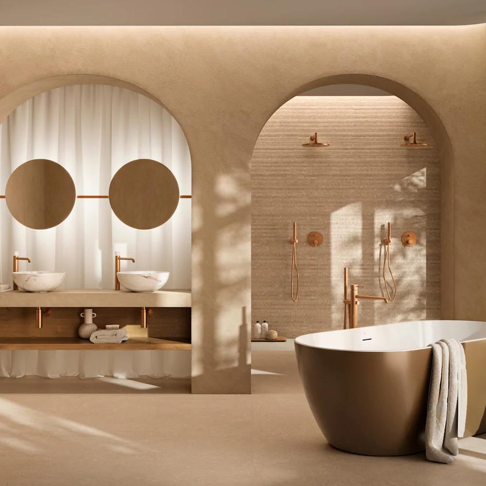 Baño wabi-sabi que destaca por su estructura en arcos y materiales naturales.