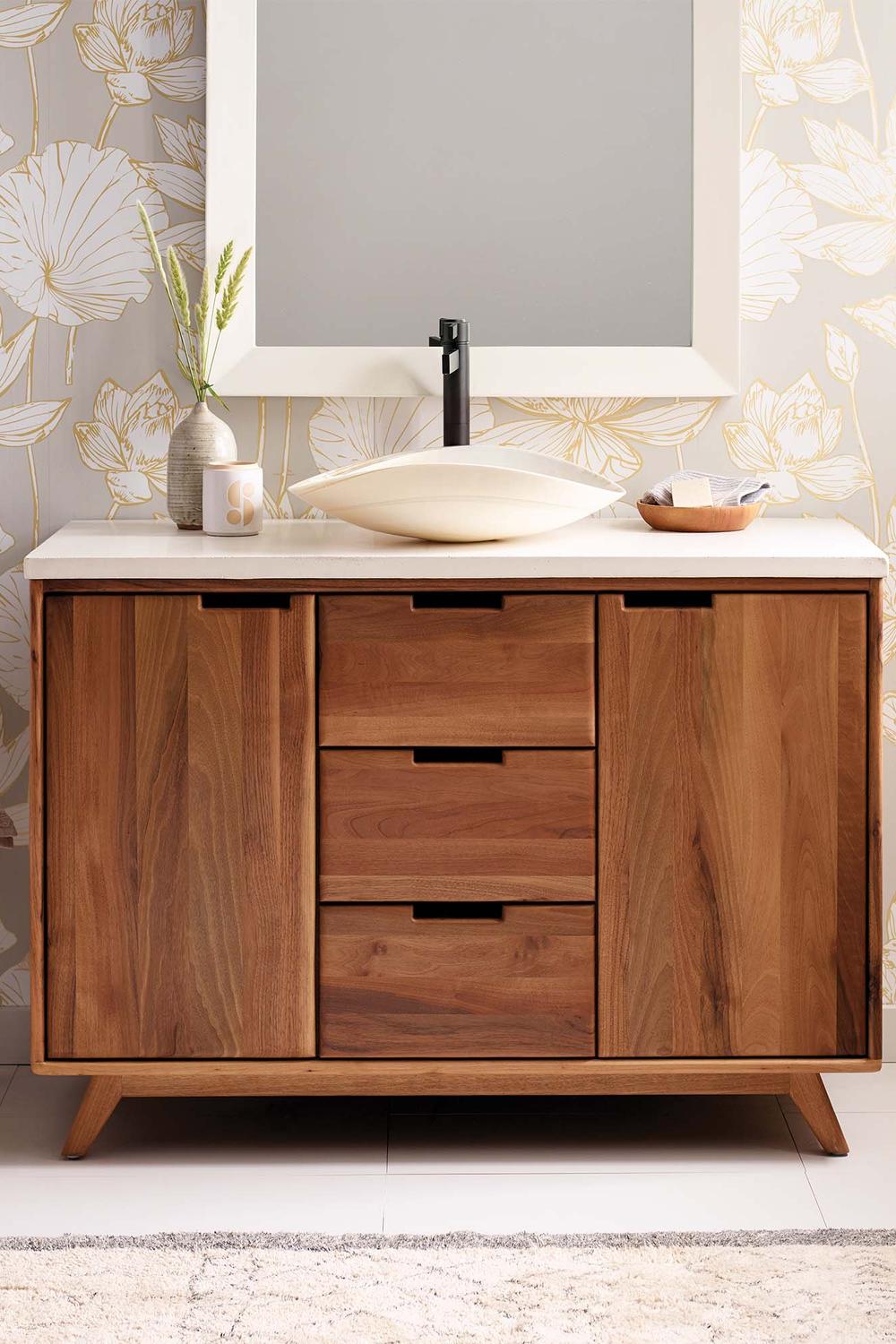 Walnut bathroom vanity featuring configuration of open and closed storage.
