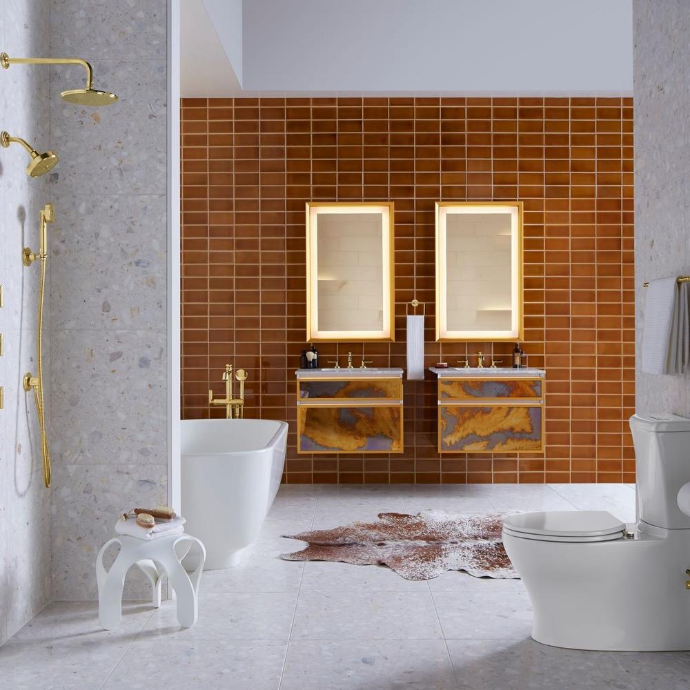 A modern bathroom featuring a freestanding tub surrounded by rich brown walls and stylish fixtures.