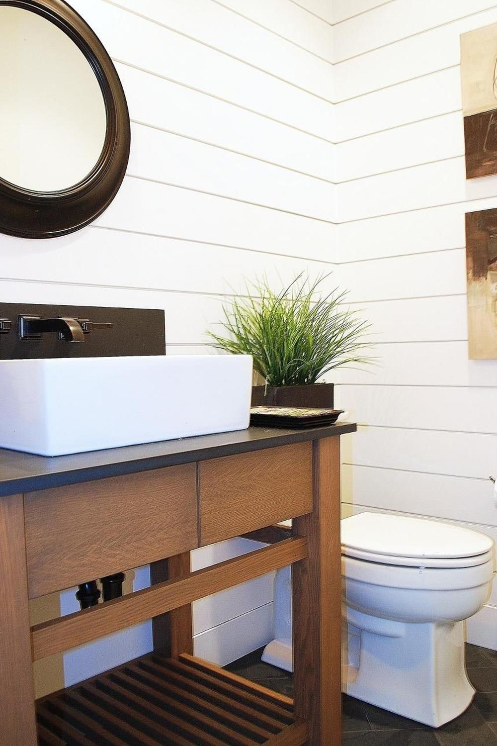 An inviting minimalistic bathroom with rounded shapes and soft design elements.