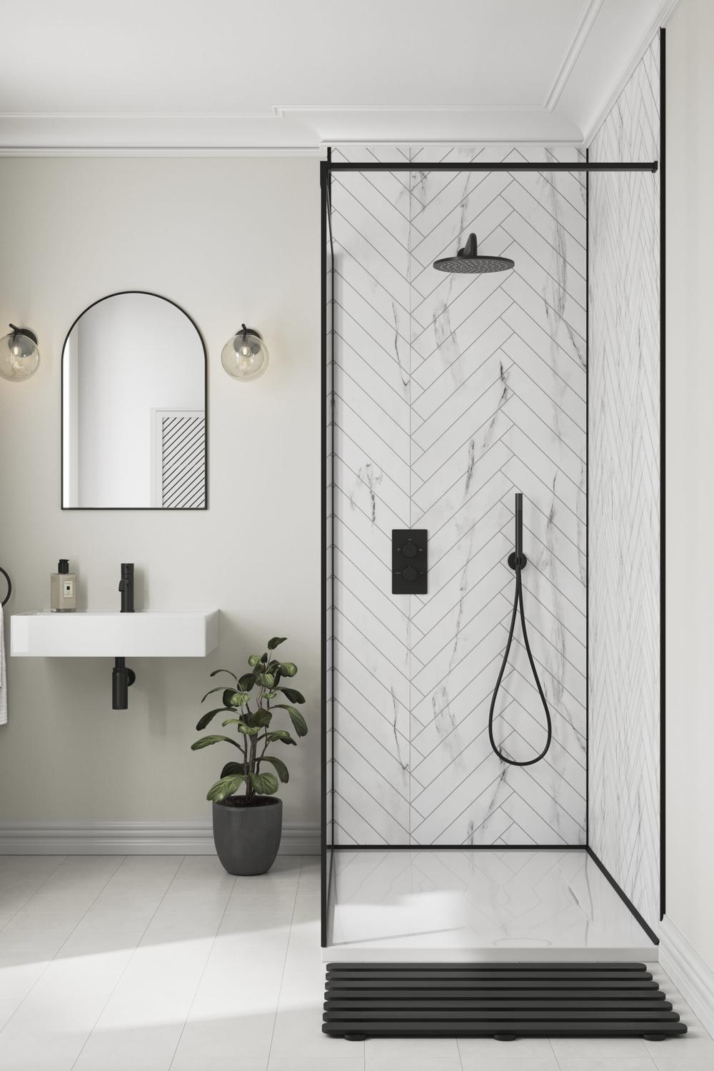 Stylish bathroom with modern floating sink, gray wall, and black-framed glass shower panels