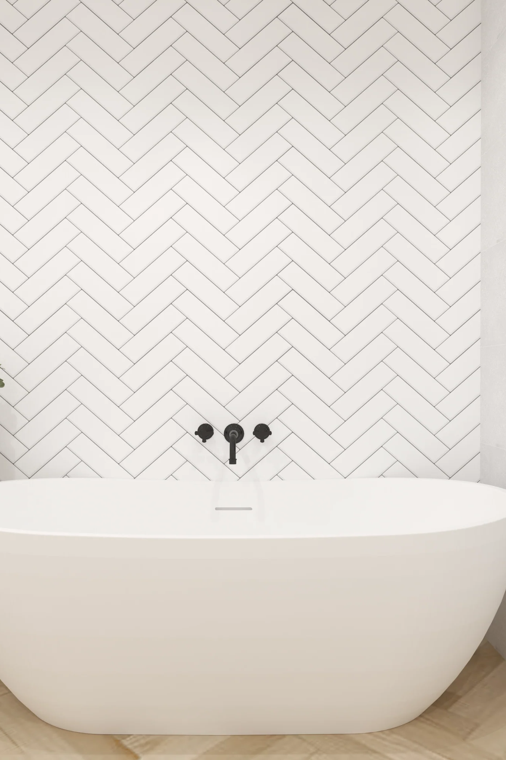 Shower area with herringbone pattern and modern freestanding bathtub