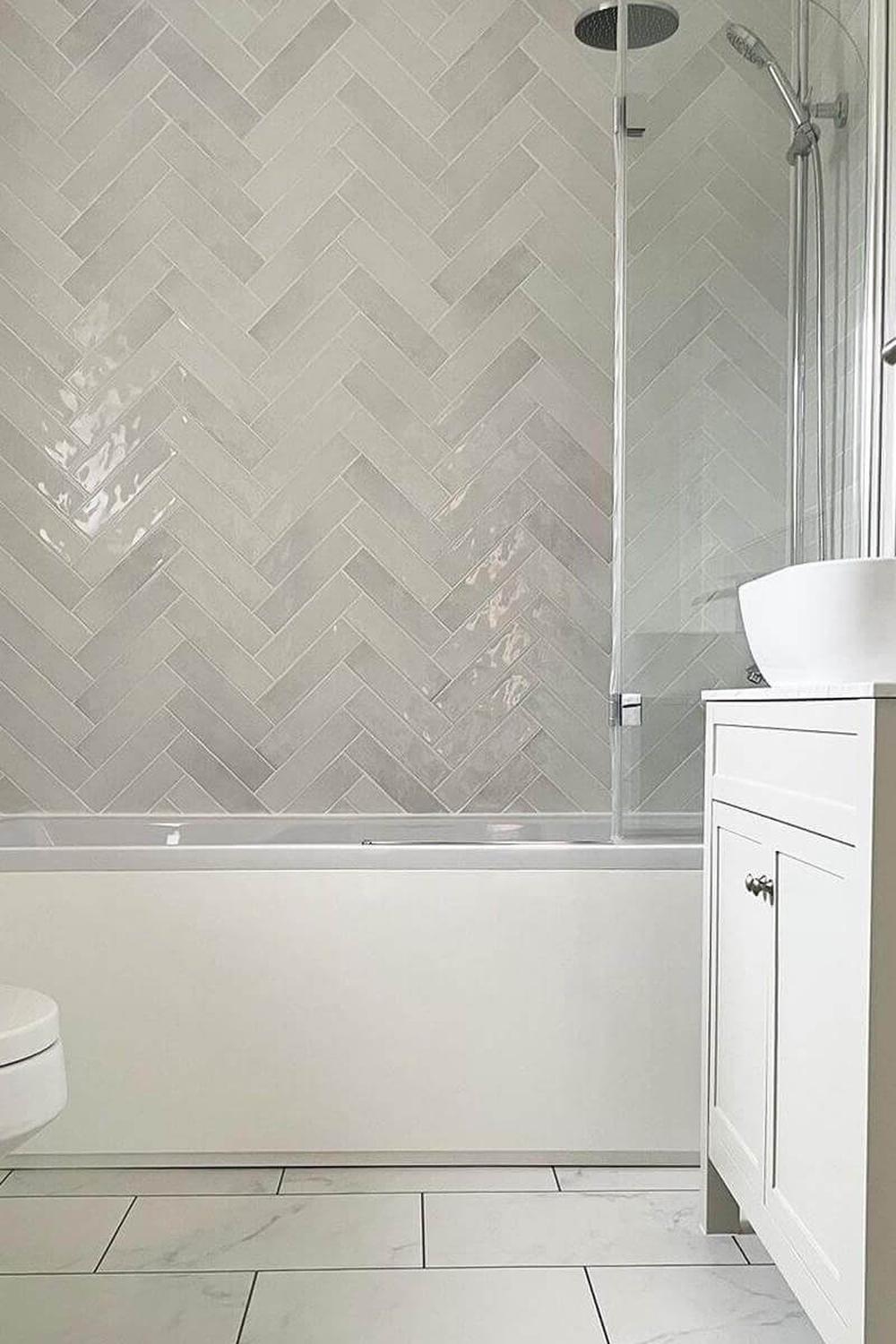 Modern bathroom with unique color contrasts and herringbone tiles