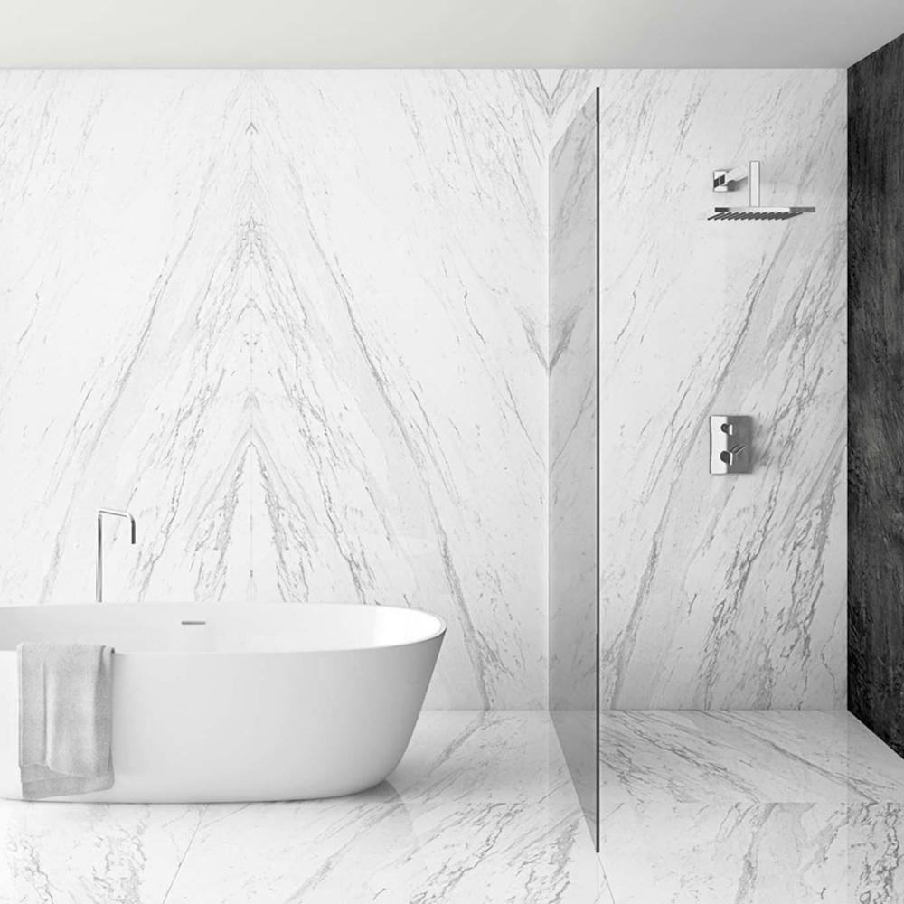 A bright and airy bathroom with a focus on minimalist design and white marble.