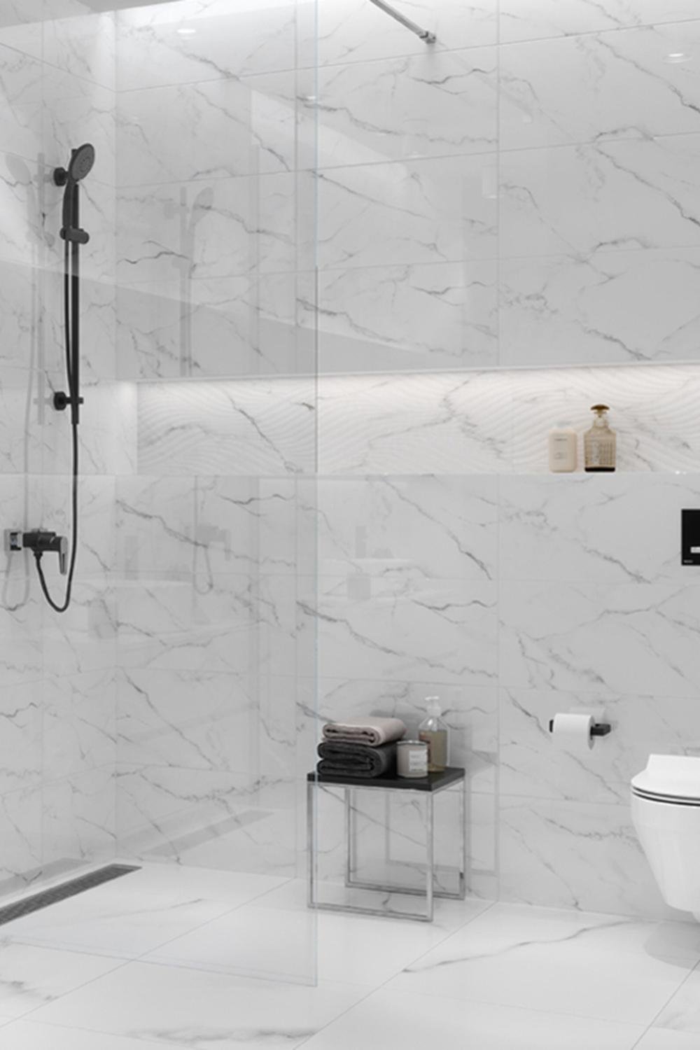 A contemporary bathroom showcasing a bright space with light marble surfaces.
