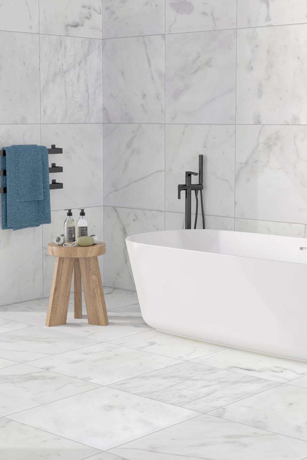 Elegant bathroom featuring glossy white marble tiles and modern fixtures for a luxurious touch.