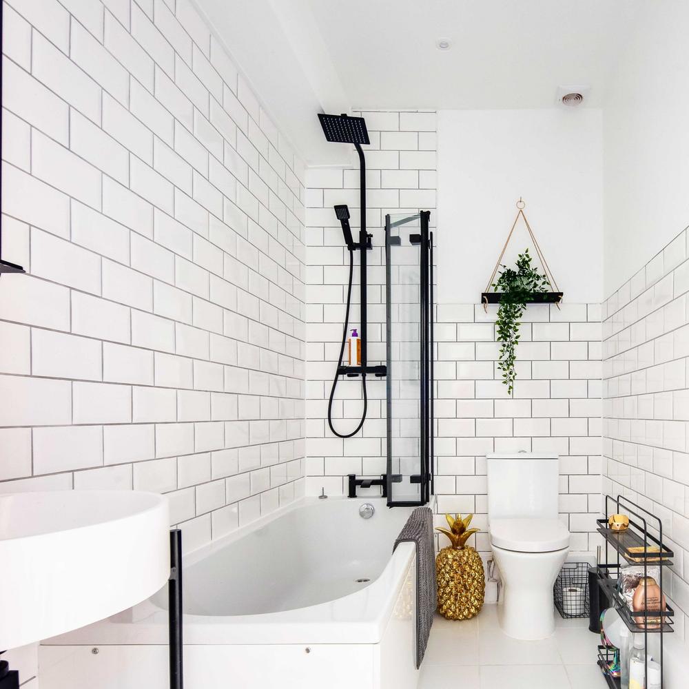 Bathroom with white metro tiles and sleek shower area