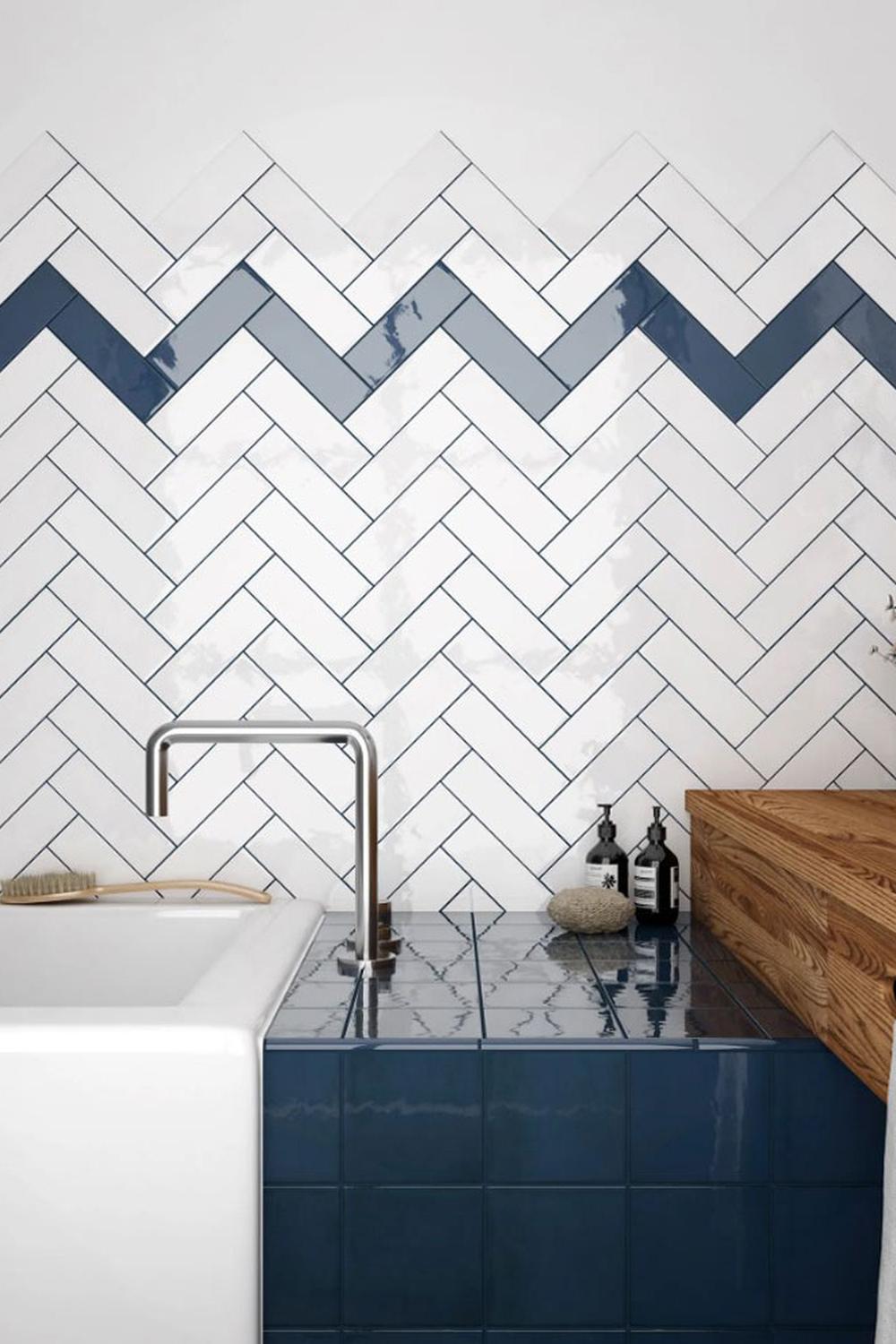 Stylish bathroom showcasing playful patterns with dark blue tiles