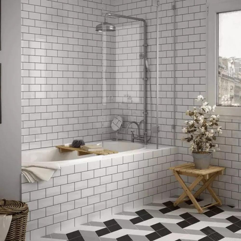 Airy bathroom with integrated bathtubs and geometric flooring