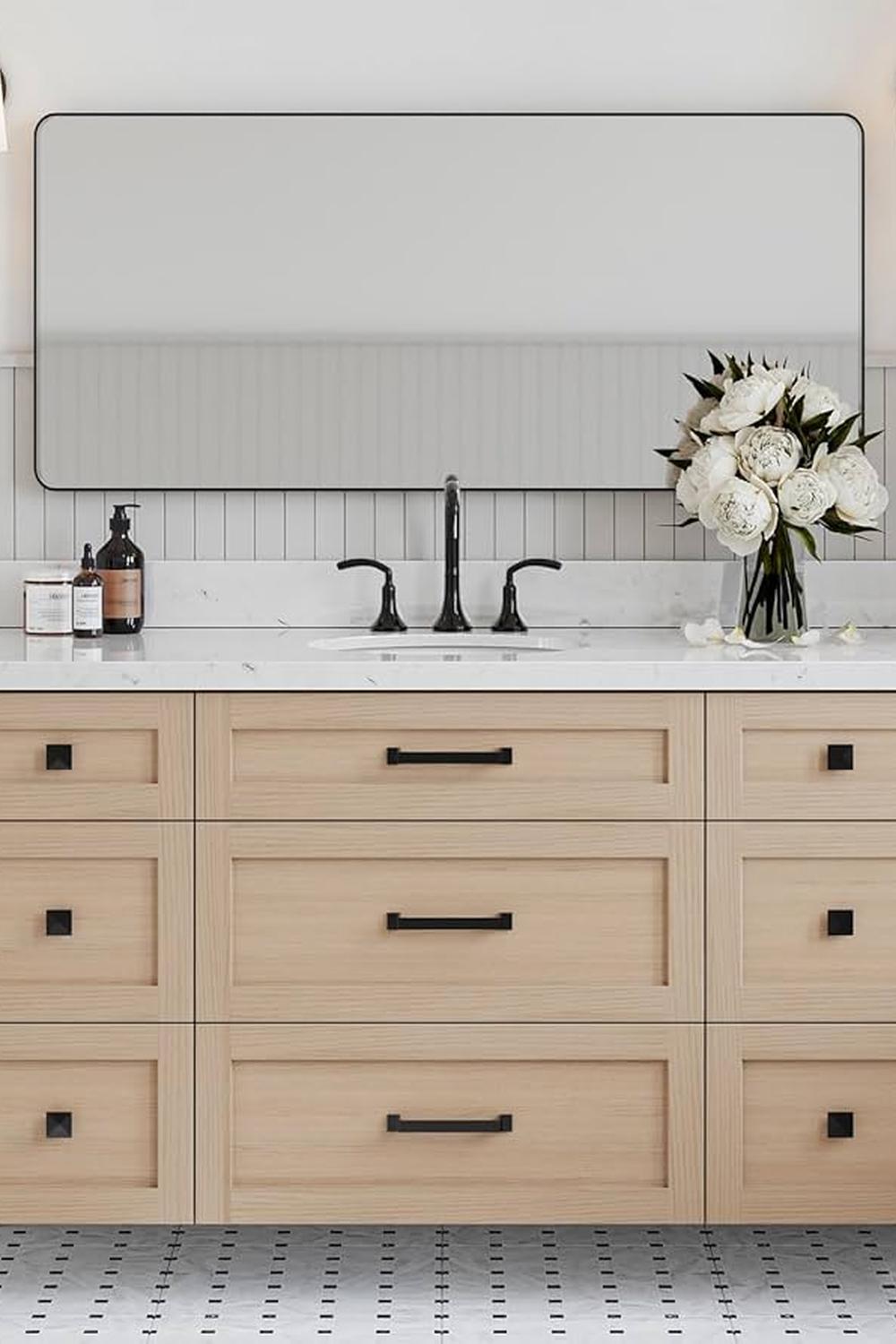 Minimalist design with white oak vanity and white marble countertop
