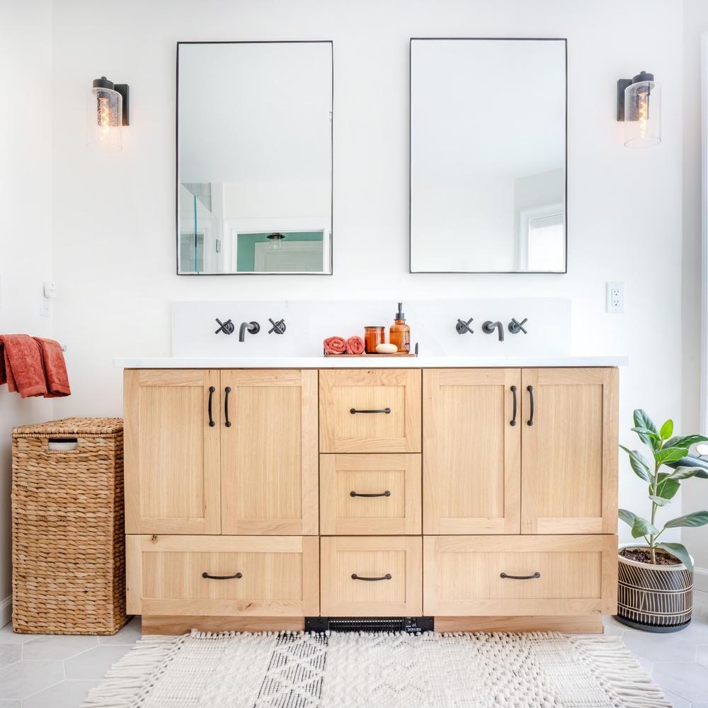 Inviting bathroom with white oak vanity and touches of gold