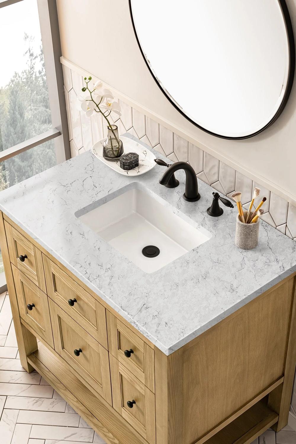 Artistic bathroom featuring white oak vanity with stylish functionality