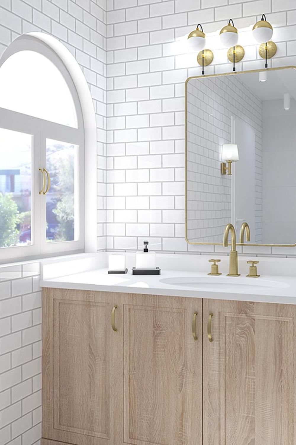Elegant bathroom design highlighting white subway tiles, wooden vanity, and gold fixtures.
