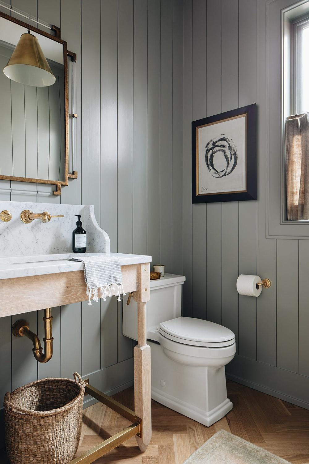 Stylish bathroom featuring muted gray vertical shiplap and contemporary design elements.
