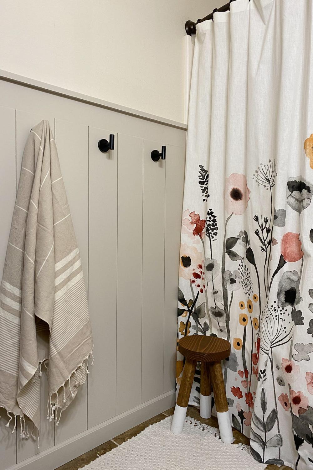 Inviting bathroom featuring vibrant accents, shiplap treatments, and a cozy decor setting.