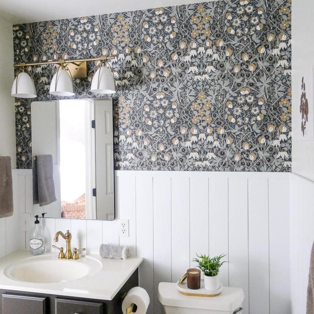 Stylish small bathroom with floral wallpaper and wainscoting