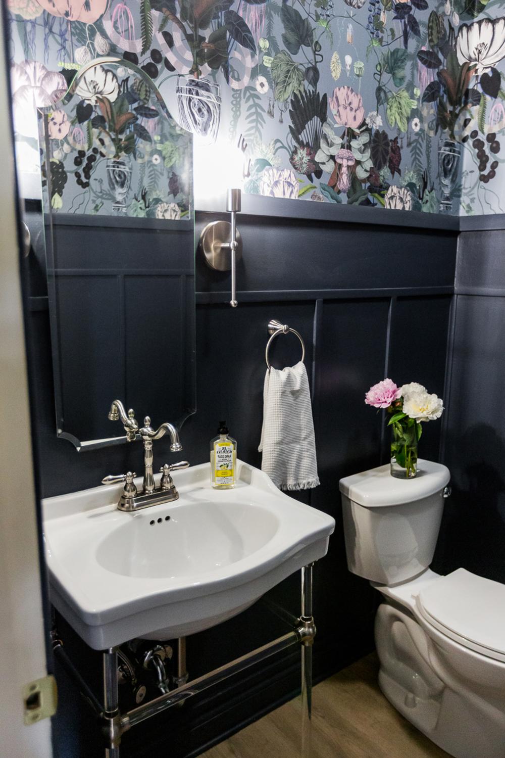 Stylish bathroom showcasing floral wallpaper and elegant water-resistant panels