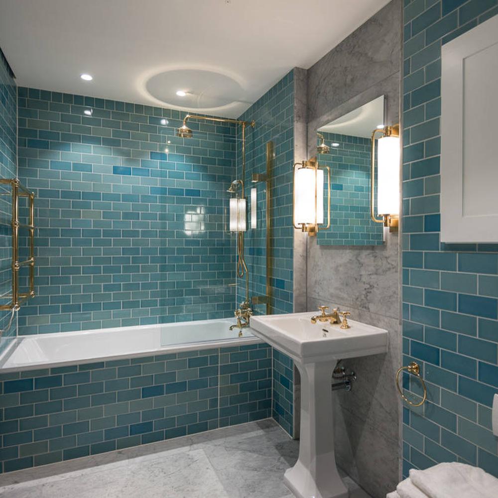Small bathroom featuring calming aquamarine tiles
