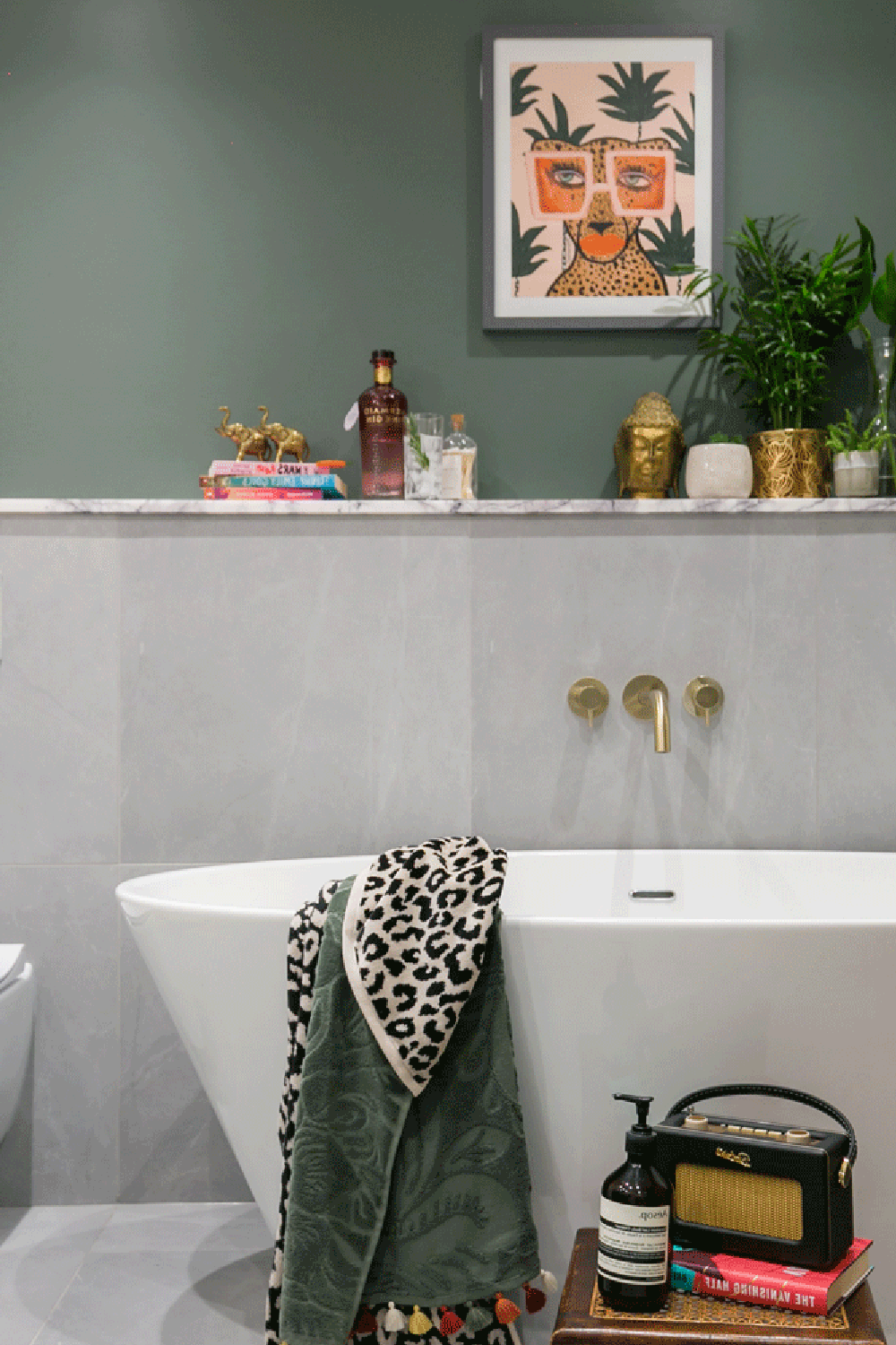 Small bathroom showcasing vibrant artwork and luxe fixtures