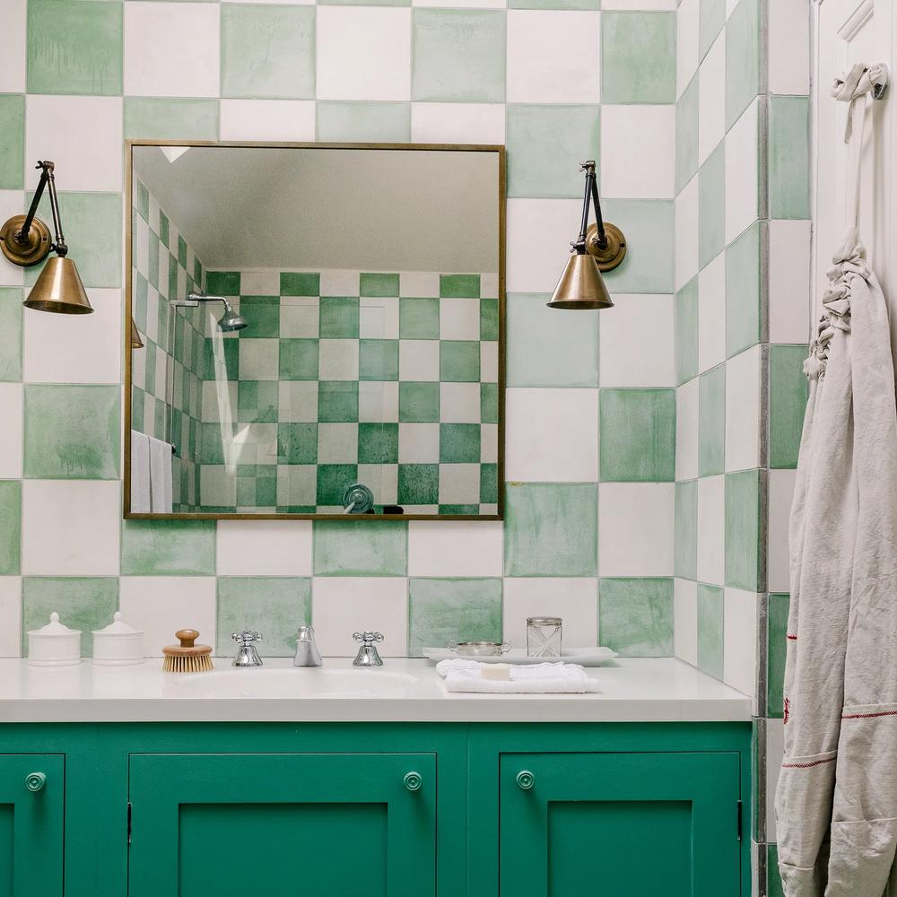 Stylish windowless bathroom showcasing dark and light tones